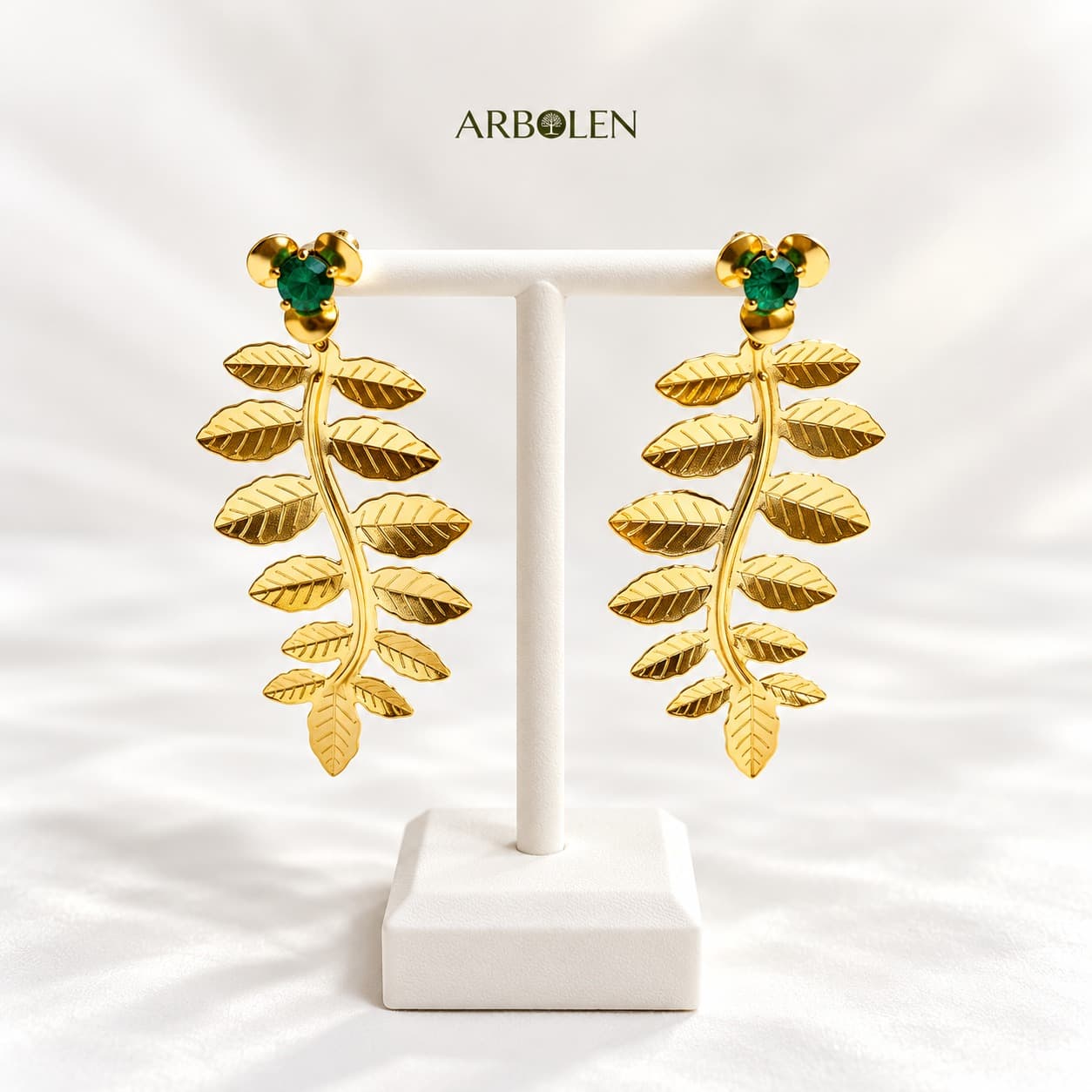 ARETES HOJAAS LARGAS CON DETALLE DE ESMERALDA